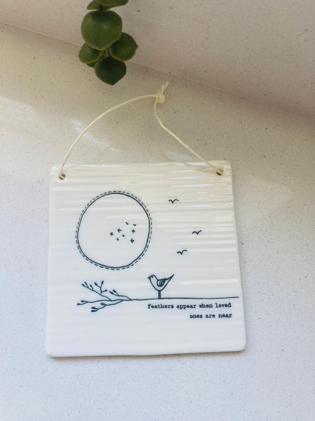 Porcelain twig picture -Feathers appear when loved ones are near